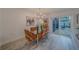 Dining area with modern furnishings and sliding doors to patio at 2700 Bayshore Blvd # 588, Dunedin, FL 34698