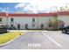 Well-kept townhome exterior with assigned parking and manicured landscaping creating a welcoming curb appeal at 2700 Bayshore Blvd # 588, Dunedin, FL 34698