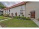 Street view of well-maintained townhomes with red tile roofs and tidy landscaping at 2700 Bayshore Blvd # 588, Dunedin, FL 34698
