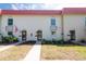 Charming condo exteriors with well-manicured lawns and vibrant landscaping offer curb appeal at 2700 Bayshore Blvd # 588, Dunedin, FL 34698