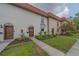 Charming townhome with red tile roof, updated landscaping, and decorative front door at 2700 Bayshore Blvd # 588, Dunedin, FL 34698