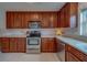 Spacious kitchen featuring stainless steel appliances, and stylish backsplash at 2700 Bayshore Blvd # 588, Dunedin, FL 34698