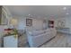 Sun-filled living room featuring stylish decor, wood floors, and a modern aesthetic at 2700 Bayshore Blvd # 588, Dunedin, FL 34698