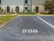 Designated parking spot #588 in front of the units with well maintained landscaping at 2700 Bayshore Blvd # 588, Dunedin, FL 34698