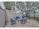 Cozy patio with cushioned outdoor seating and an umbrella, perfect for relaxation at 2700 Bayshore Blvd # 588, Dunedin, FL 34698