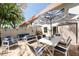 Outdoor patio featuring brick flooring, outdoor seating, and patio umbrellas at 2700 Bayshore Blvd # 588, Dunedin, FL 34698