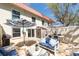 A spacious patio area with blue cushioned seating, dining, and outdoor storage, ideal for leisure and convenience at 2700 Bayshore Blvd # 588, Dunedin, FL 34698