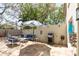 Cozy outdoor patio with comfortable seating, a grill, and shade, perfect for relaxation and entertaining at 2700 Bayshore Blvd # 588, Dunedin, FL 34698