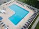 Resort-style pool surrounded by lounge chairs for relaxing in the sun at 2700 Bayshore Blvd # 588, Dunedin, FL 34698