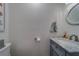 Tastefully designed powder room with marble counter and decorative mirror at 2700 Bayshore Blvd # 588, Dunedin, FL 34698