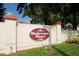 Community sign reading Mediterranean Manors 2700, set amidst lush greenery at 2700 Bayshore Blvd # 588, Dunedin, FL 34698
