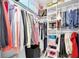 Organized walk-in closet with ample shelving, hanging space, and storage boxes at 2700 Bayshore Blvd # 588, Dunedin, FL 34698