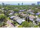 Wide aerial view of the neighborhood, showcasing lush greenery, nearby water, and the surrounding cityscape at 3006 W Angeles St, Tampa, FL 33629