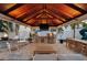 The backyard has an outdoor kitchen, TV, play structure, and fire pit, creating an entertainment oasis at 3006 W Angeles St, Tampa, FL 33629