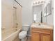 Functional bathroom with tub and shower combination, sink vanity, and coordinating fixtures at 30103 Mossbank Dr, Wesley Chapel, FL 33543