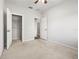 Open bedroom with access to walk-in closet, showcasing the spacious layout and convenience at 30103 Mossbank Dr, Wesley Chapel, FL 33543