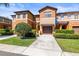Two-story townhouse features a one car garage and landscaped front yard at 30103 Mossbank Dr, Wesley Chapel, FL 33543