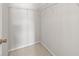 Spacious walk-in closet with wire shelving and neutral carpeting provides ample storage at 30103 Mossbank Dr, Wesley Chapel, FL 33543
