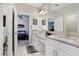 Bright bathroom features double sinks, granite countertops and views to bedroom at 30300 Southwell Ln, Wesley Chapel, FL 33543