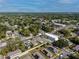 Aerial view of property in a residential area with nearby businesses and mature landscaping at 3402 E 28Th Ave # 4, Tampa, FL 33605