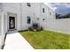 An inviting fenced backyard, offering privacy and a modern A/C unit nestled in the landscaping at 3402 E 28Th Ave # 4, Tampa, FL 33605