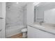 Bathroom with marble tile, soaking tub, and white vanity with quartz counters at 3402 E 28Th Ave # 4, Tampa, FL 33605