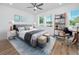 Tastefully decorated bedroom with a modern gray bed, stylish artwork, and a desk for work at 3402 E 28Th Ave # 4, Tampa, FL 33605