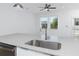 Kitchen island with stainless steel sink, quartz countertop, and stainless steel appliances at 3402 E 28Th Ave # 4, Tampa, FL 33605