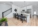 Bright kitchen with stainless appliances, quartz countertops, barstool seating, and open view to the living space at 3402 E 28Th Ave # 4, Tampa, FL 33605