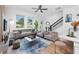 Stylish living room with modern furniture, hardwood floors, and staircase at 3402 E 28Th Ave # 4, Tampa, FL 33605