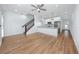 Open-concept living area with modern kitchen, hardwood floors and staircase at 3402 E 28Th Ave # 4, Tampa, FL 33605