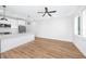Contemporary kitchen open to living area with stainless steel appliances and breakfast bar at 3402 E 28Th Ave # 4, Tampa, FL 33605