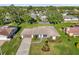 A high angle shows the well maintained lawns, landscaping, and fences for the home and neighbors at 4065 38Th S St, St Petersburg, FL 33711