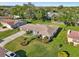 A high angle view shows the home's lush lawn, landscaping, and surrounding neighborhood at 4065 38Th S St, St Petersburg, FL 33711