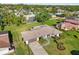 A high angle photo show a long driveway and manicured lawns and landscaping at 4065 38Th S St, St Petersburg, FL 33711