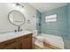 Beautiful bathroom with a dark wood vanity, tiled walls, and a tub-shower combo at 4065 38Th S St, St Petersburg, FL 33711