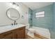 Bathroom featuring a vanity with granite countertop, bathtub and subway tile at 4065 38Th S St, St Petersburg, FL 33711
