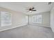 This spacious bedroom is carpeted and boasts two windows and a ceiling fan at 4065 38Th S St, St Petersburg, FL 33711