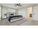 Serene main bedroom with a ceiling fan, neutral paint, and ensuite bathroom at 4065 38Th S St, St Petersburg, FL 33711