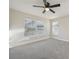 Bedroom featuring natural light, a ceiling fan, and neutral carpet flooring at 4065 38Th S St, St Petersburg, FL 33711