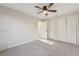 Light-filled bedroom with plush carpet and white trim, featuring a ceiling fan at 4065 38Th S St, St Petersburg, FL 33711