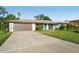 Charming home with a well-kept lawn, inviting facade, and spacious driveway at 4065 38Th S St, St Petersburg, FL 33711