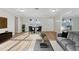 Bright living room featuring wood floors, neutral paint, and ample natural light at 4065 38Th S St, St Petersburg, FL 33711