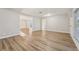 Bright, open living room with wood-look floors, neutral paint, and plenty of natural light at 4065 38Th S St, St Petersburg, FL 33711
