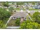 Aerial of home featuring an enclosed patio, landscaped yard, and residential surroundings at 4307 Dristol Ave, Spring Hill, FL 34609