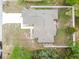 Overhead view of home with neutral roof, manicured landscaping, a driveway, and perimeter fencing at 4307 Dristol Ave, Spring Hill, FL 34609