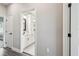 Hallway view into a bathroom with double vanity and white cabinets at 4307 Dristol Ave, Spring Hill, FL 34609