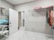 Spacious walk-in closet with white marble floors and wire shelving at 4307 Dristol Ave, Spring Hill, FL 34609