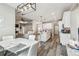 Open-concept layout shows dining room, kitchen, and living room with sleek hardwood flooring at 4307 Dristol Ave, Spring Hill, FL 34609