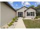Charming single-story home featuring a screened entryway and well-maintained landscaping at 4307 Dristol Ave, Spring Hill, FL 34609